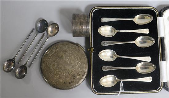 A cased set of six Art Deco silver teaspoons, an Egyptian silver compact, a silver napkin ring and four plated teaspoons.